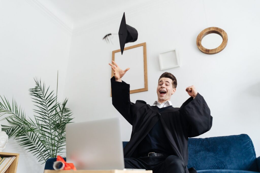 A new graduate celebrating because of his new direct sales job.