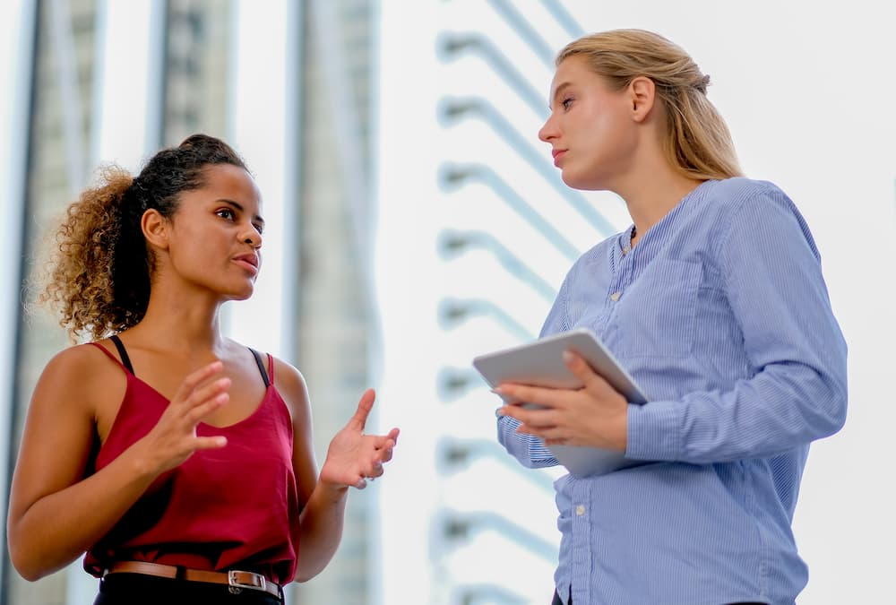 A sales representative asking customer needs.